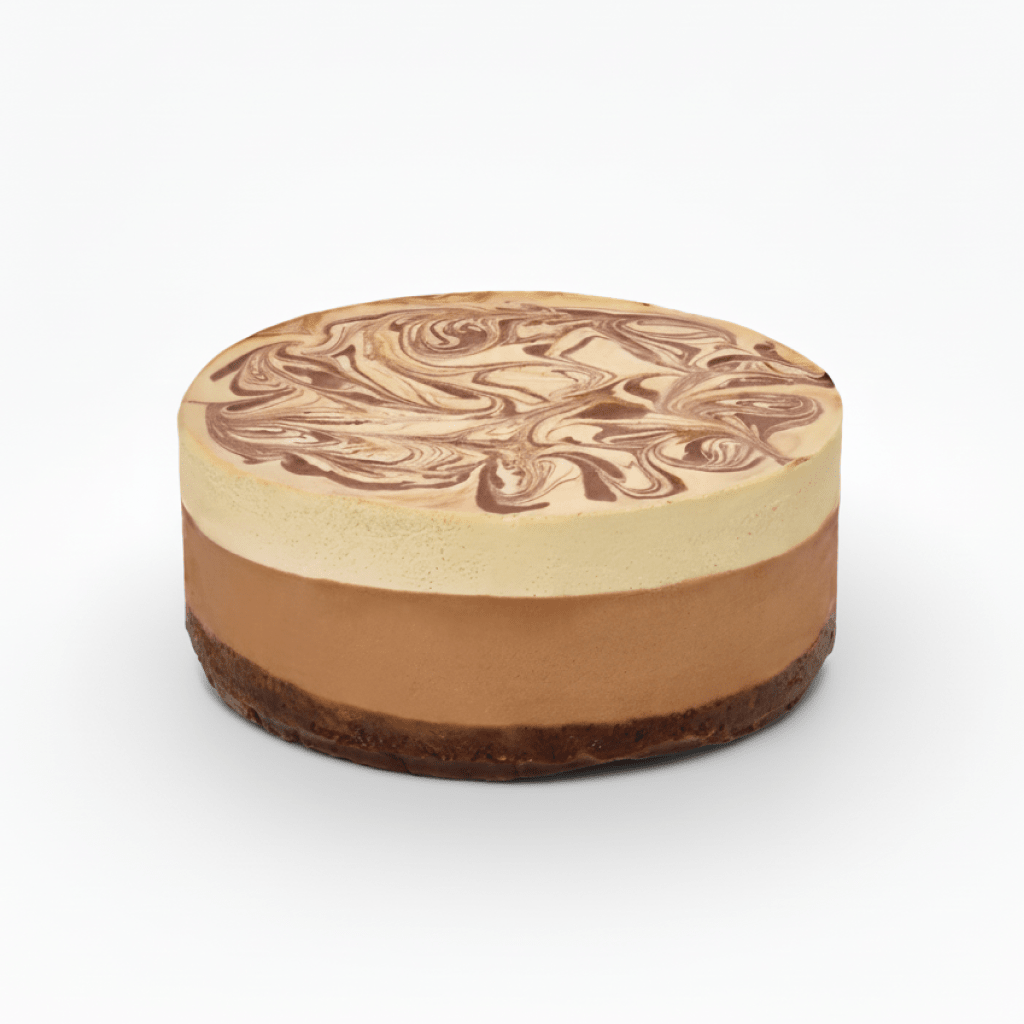 Cacao Pecan raw vegan cake with layered chocolate and cream swirled top on a nutty crust