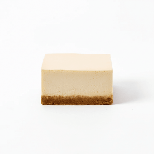 A square slice of Lemon dessert with a smooth pale yellow top layer and a crumbly brown crust underneath.